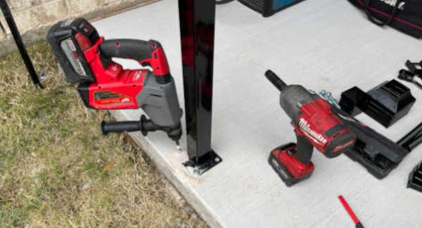 hammer-drill--concrete-anchors | inspired-ironworks-fence-installation