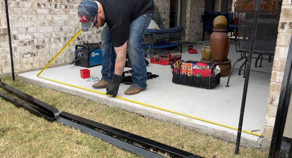 marking-iron-fence-layout, measuring-metal-gate, iron-fence-contractors