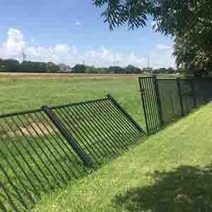 leaning-metal-fence-posts | golf-course-fence-repair